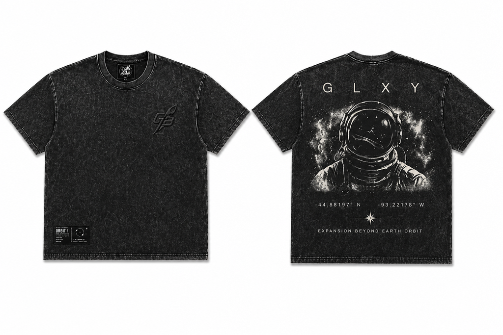 Front and back view of the GLXY Orbit 001 Vintage Black acid-wash t-shirt showing rocket emblem and astronaut graphic